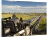 Safari Vehicle Crossing Bridge by Anonymous