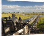 Safari Vehicle Crossing Bridge by Anonymous