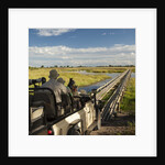 Safari Vehicle Crossing Bridge by Anonymous