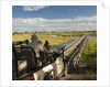 Safari Vehicle Crossing Bridge by Anonymous