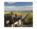 Safari Vehicle Crossing Bridge by Anonymous