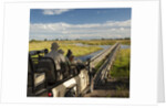 Safari Vehicle Crossing Bridge by Anonymous