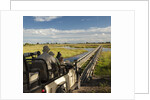 Safari Vehicle Crossing Bridge by Anonymous