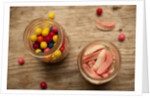 Bubble gum balls and teeth candy in mason jars by Anonymous