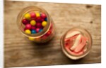 Bubble gum balls and teeth candy in mason jars by Anonymous