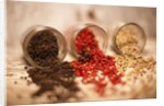 Black, red, and white pepper corns in rustic mason jars by Anonymous