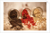 Black, red, and white pepper corns in rustic mason jars by Anonymous
