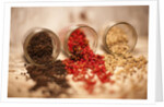 Black, red, and white pepper corns in rustic mason jars by Anonymous