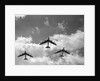 1950s three B-52 bomber airplanes in flight formation by Anonymous
