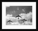 1950s three B-52 bomber airplanes in flight formation by Anonymous