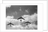 1950s three B-52 bomber airplanes in flight formation by Anonymous