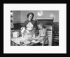 1950s mother and daughter baking a cake by Anonymous