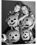 1950s boy and girl with four jack-o-lanterns by Anonymous
