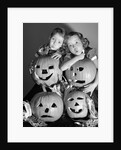 1950s boy and girl with four jack-o-lanterns by Anonymous
