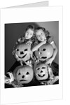 1950s boy and girl with four jack-o-lanterns by Anonymous