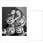 1950s boy and girl with four jack-o-lanterns by Anonymous