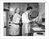 1950s smiling couple washing the dishes together by Anonymous