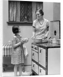 1920s young girl helping her mother to cook by Anonymous
