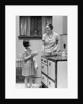1920s young girl helping her mother to cook by Anonymous