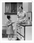 1920s young girl helping her mother to cook by Anonymous