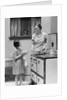 1920s young girl helping her mother to cook by Anonymous