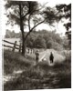 1930s boy and girl in straw hats walking down farm road by Anonymous