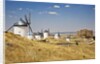 Antique La Mancha windmills and castle in Consuegra, Spain by Anonymous