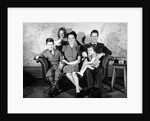 1930s 1940s family of five on a couch by Anonymous