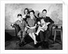 1930s 1940s family of five on a couch by Anonymous