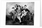 1930s 1940s family of five on a couch by Anonymous