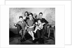 1930s 1940s family of five on a couch by Anonymous