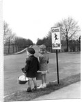 1930s 1940s boy and girl waiting to cross the road by Anonymous