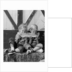 1960s boy and girl sharing a slice of watermelon by Anonymous