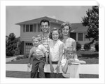 1960s family portrait in front of horse by Anonymous