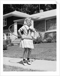 1950s girl on suburban sidewalk playing with a hula hoop by Anonymous