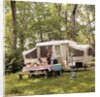1970s family having picnic by camper by Anonymous