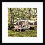 1970s family having picnic by camper by Anonymous
