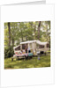 1970s family having picnic by camper by Anonymous