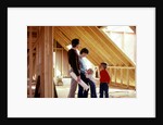 1980s family of four inspecting new home under construction by Anonymous