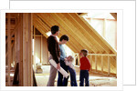 1980s family of four inspecting new home under construction by Anonymous
