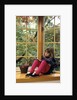 Little girl reading at home by Anonymous