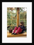 Little girl reading at home by Anonymous