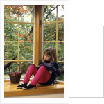 Little girl reading at home by Anonymous