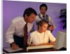 Business people working together at desktop computer by Anonymous