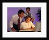 Business people working together at desktop computer by Anonymous