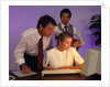 Business people working together at desktop computer by Anonymous