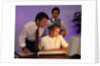 Business people working together at desktop computer by Anonymous