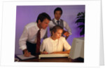 Business people working together at desktop computer by Anonymous