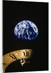 Earth and clock face at 11:57 by Anonymous