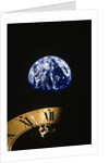 Earth and clock face at 11:57 by Anonymous